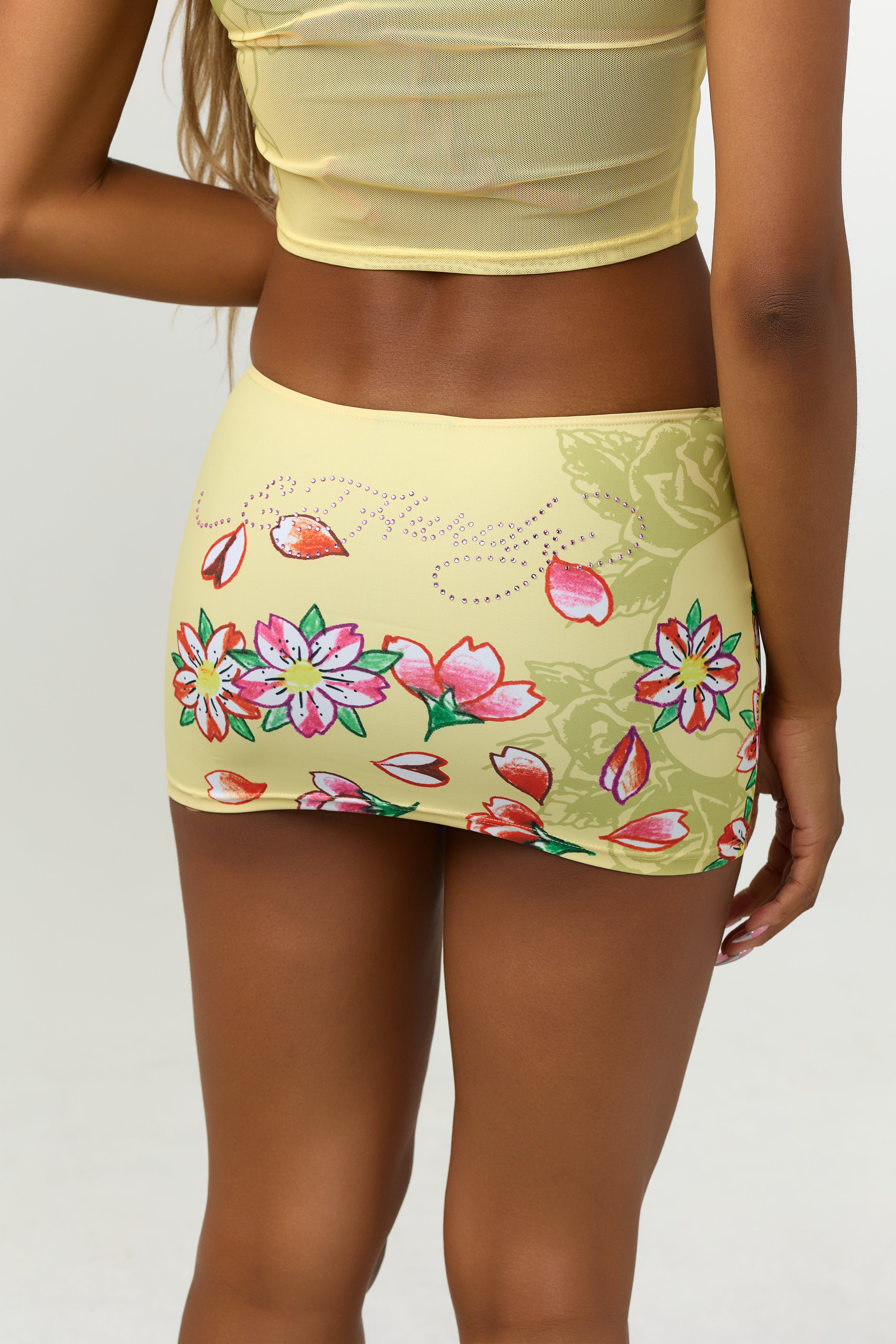 Woman wearing Ed Hardy Vintage Rose Swim Skirt in yellow print