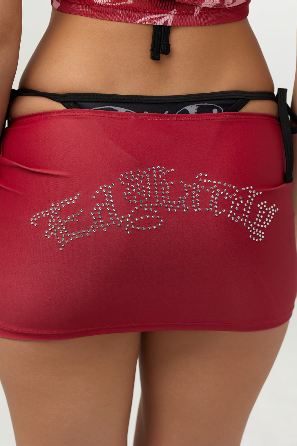 Woman wearing Ed Hardy Crimson Tiger Swim Skirt in red print