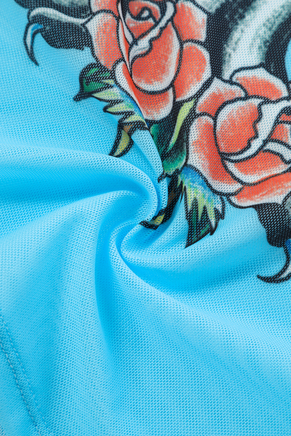 Close-up detail of Ed Hardy Sky Pantheress Swim Tee in light blue print