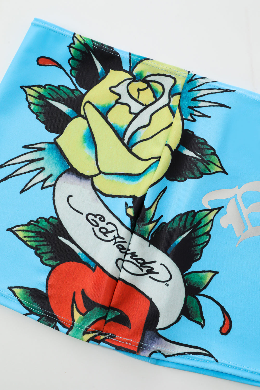 Close-up detail of Ed Hardy Sky Panthress Swim Skirt in light blue print