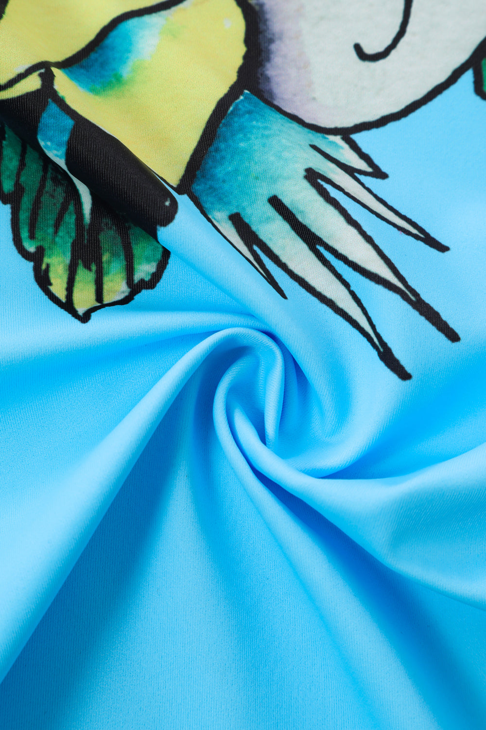 Close-up detail of Ed Hardy Sky Panthress Swim Skirt in light blue print
