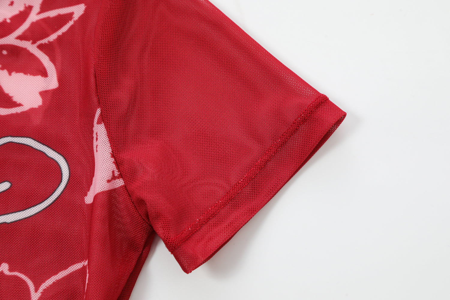 Close-up detail of Ed Hardy Crimson Tiger Swim Tee in red print