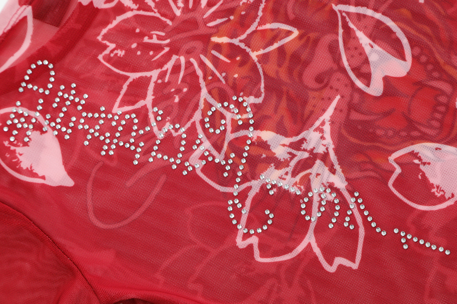 Close-up detail of Ed Hardy Crimson Tiger Swim Tee in red print