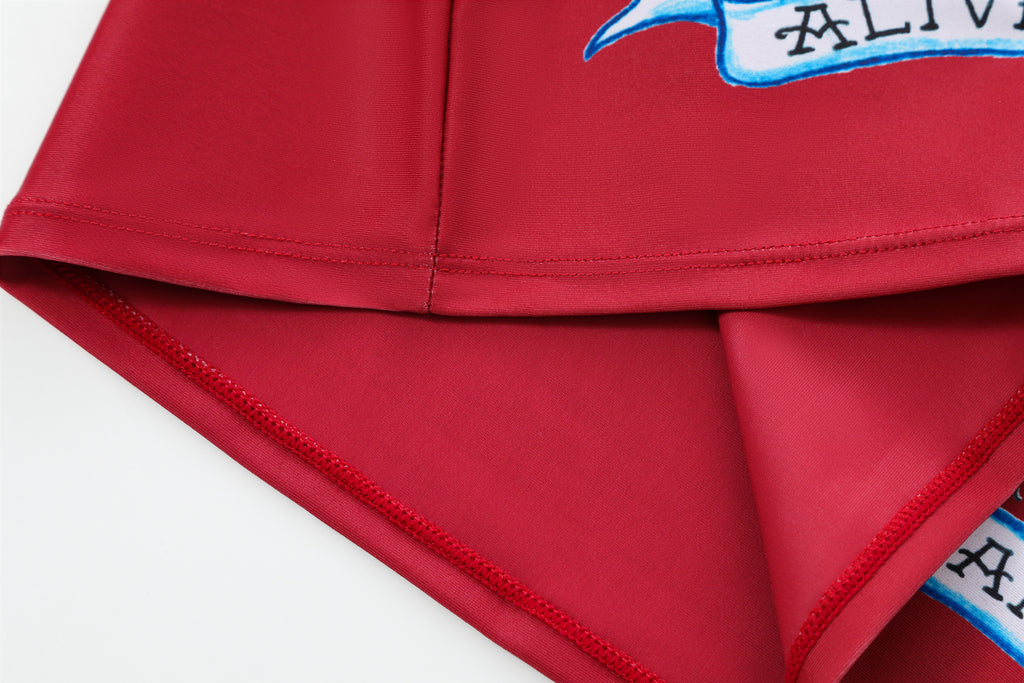 Close-up detail of Ed Hardy Crimson Tiger Swim Skirt in red print