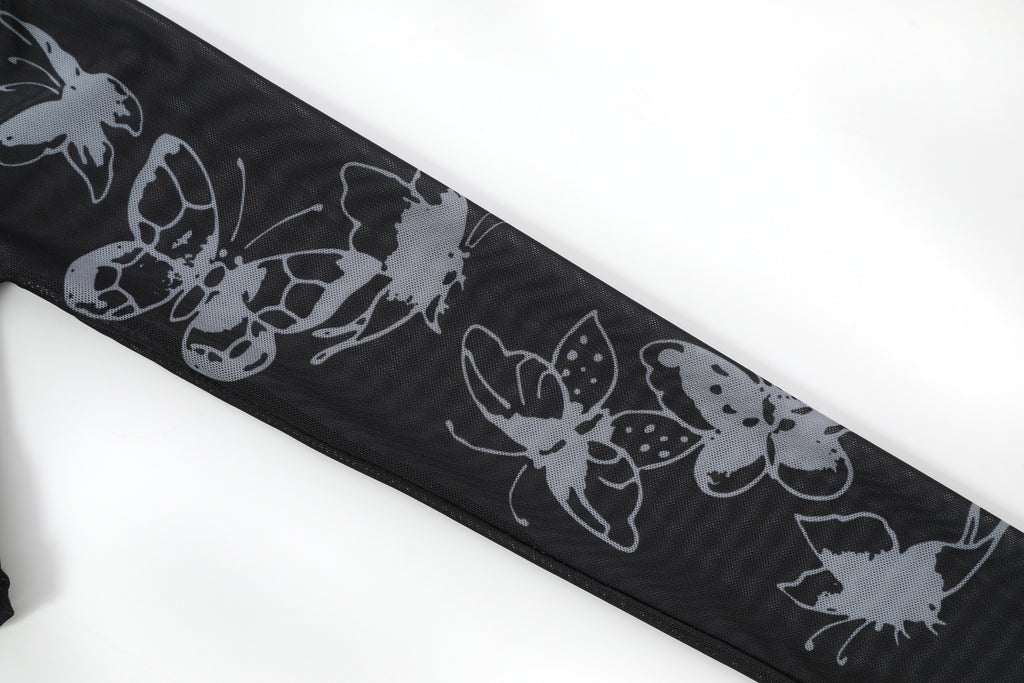 Close-up detail of Ed Hardy Glimmer Goth Mesh Maxi Set in black print