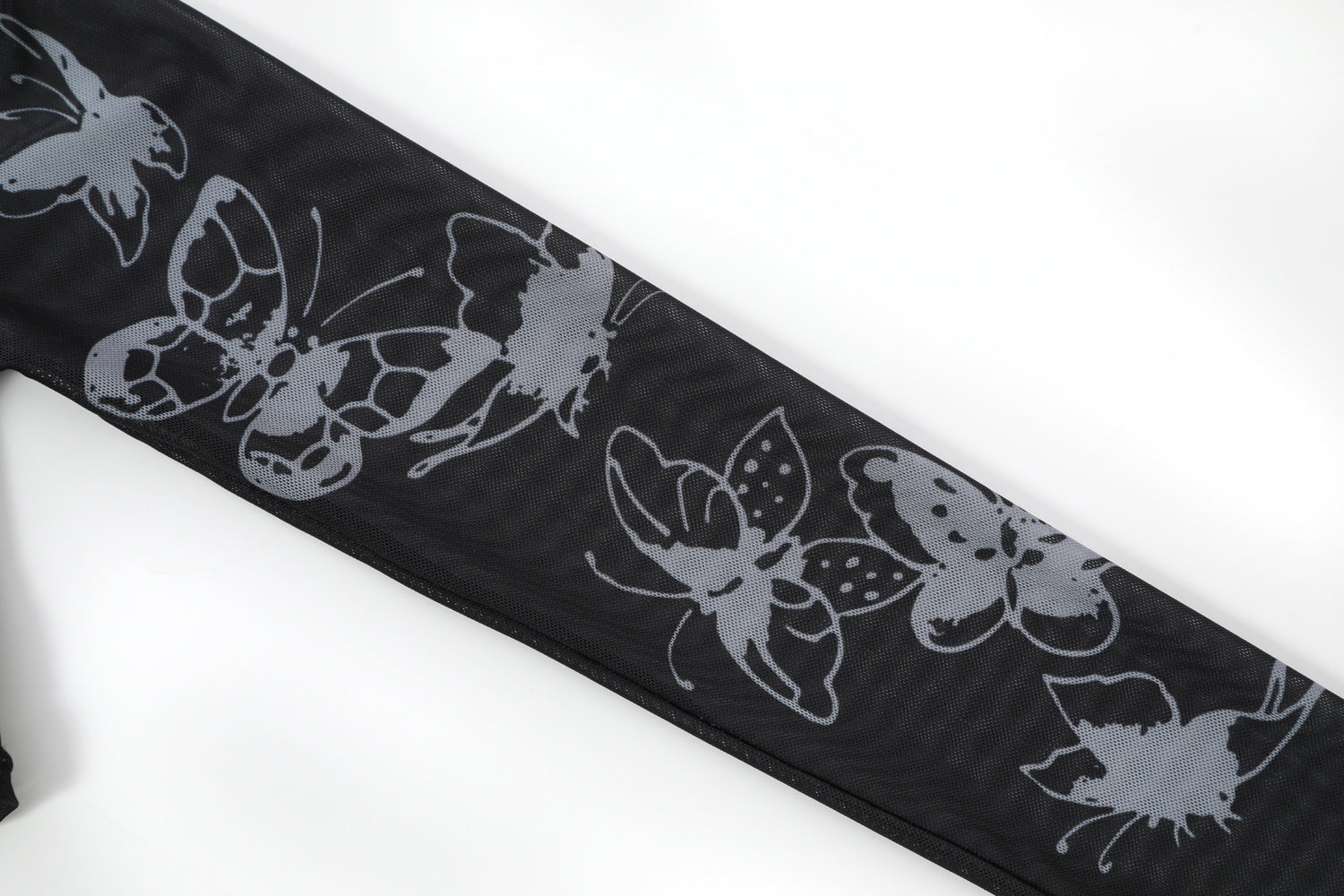 Close-up detail of Ed Hardy Glimmer Goth Mesh Maxi Set in black print