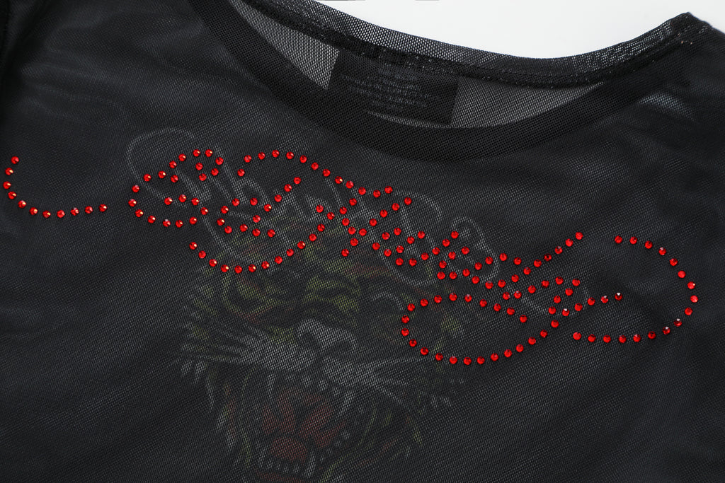 Close-up detail of Ed Hardy Glimmer Goth Mesh Maxi Set in black print