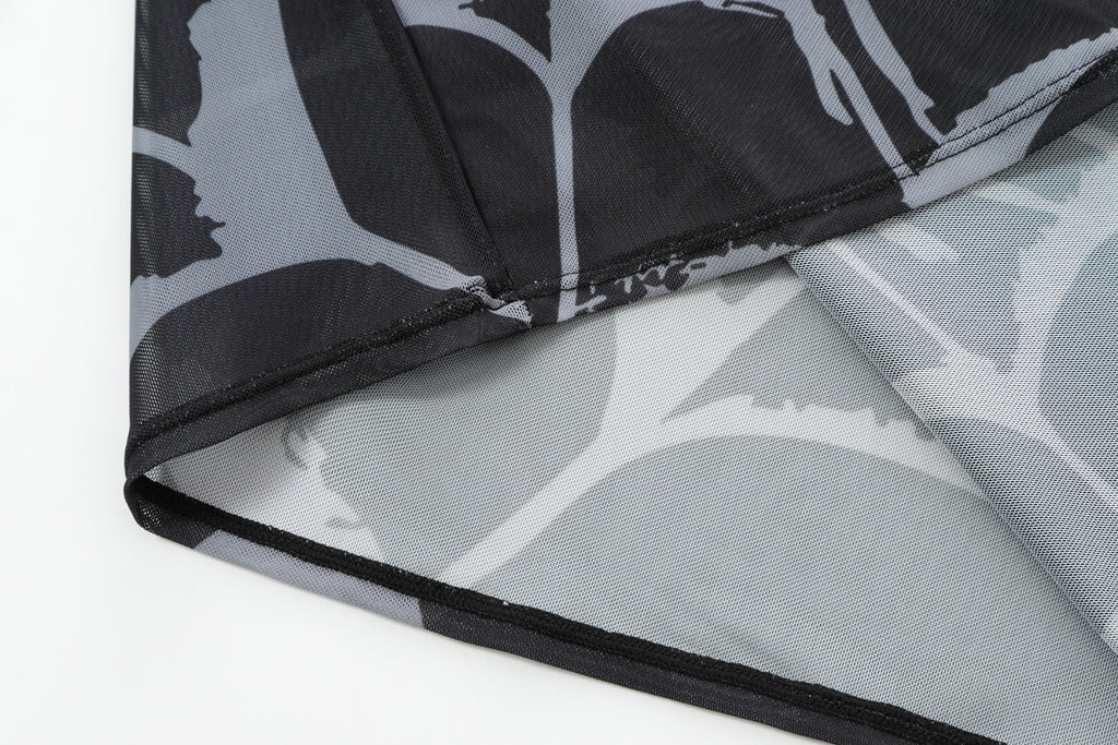 Close-up detail of Ed Hardy Glimmer Goth Mesh Maxi Set in black print
