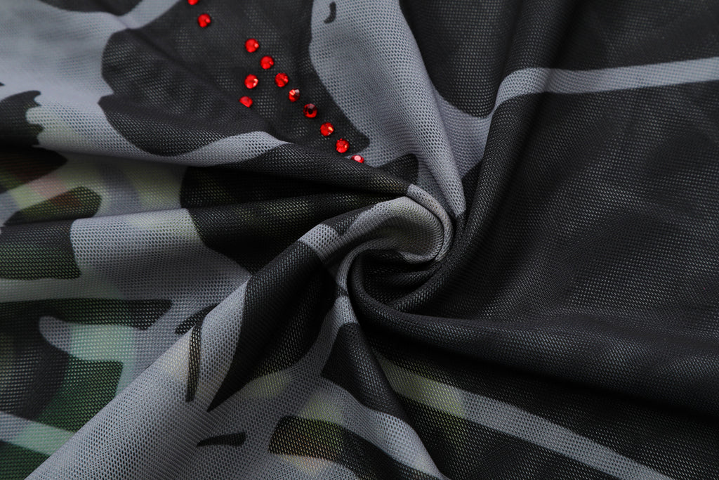 Close-up detail of Ed Hardy Glimmer Goth Mesh Maxi Set in black print