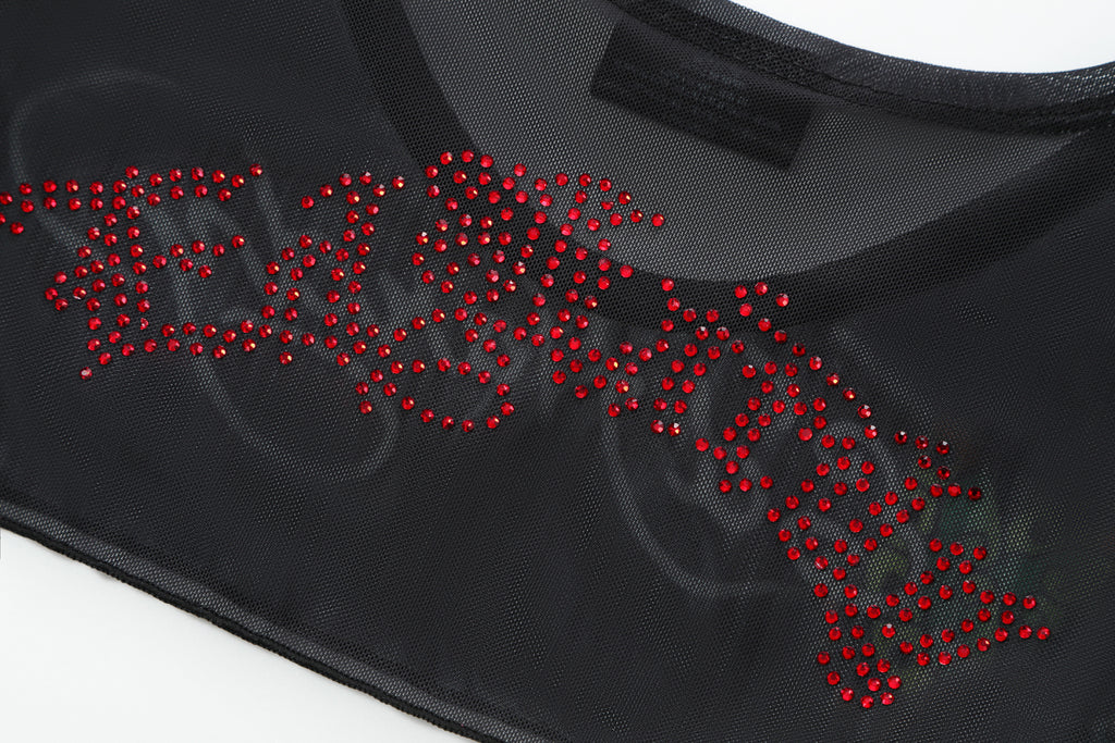 Close-up detail of Ed Hardy Midnight Cropped Mesh Longsleeve Cover Up in print
