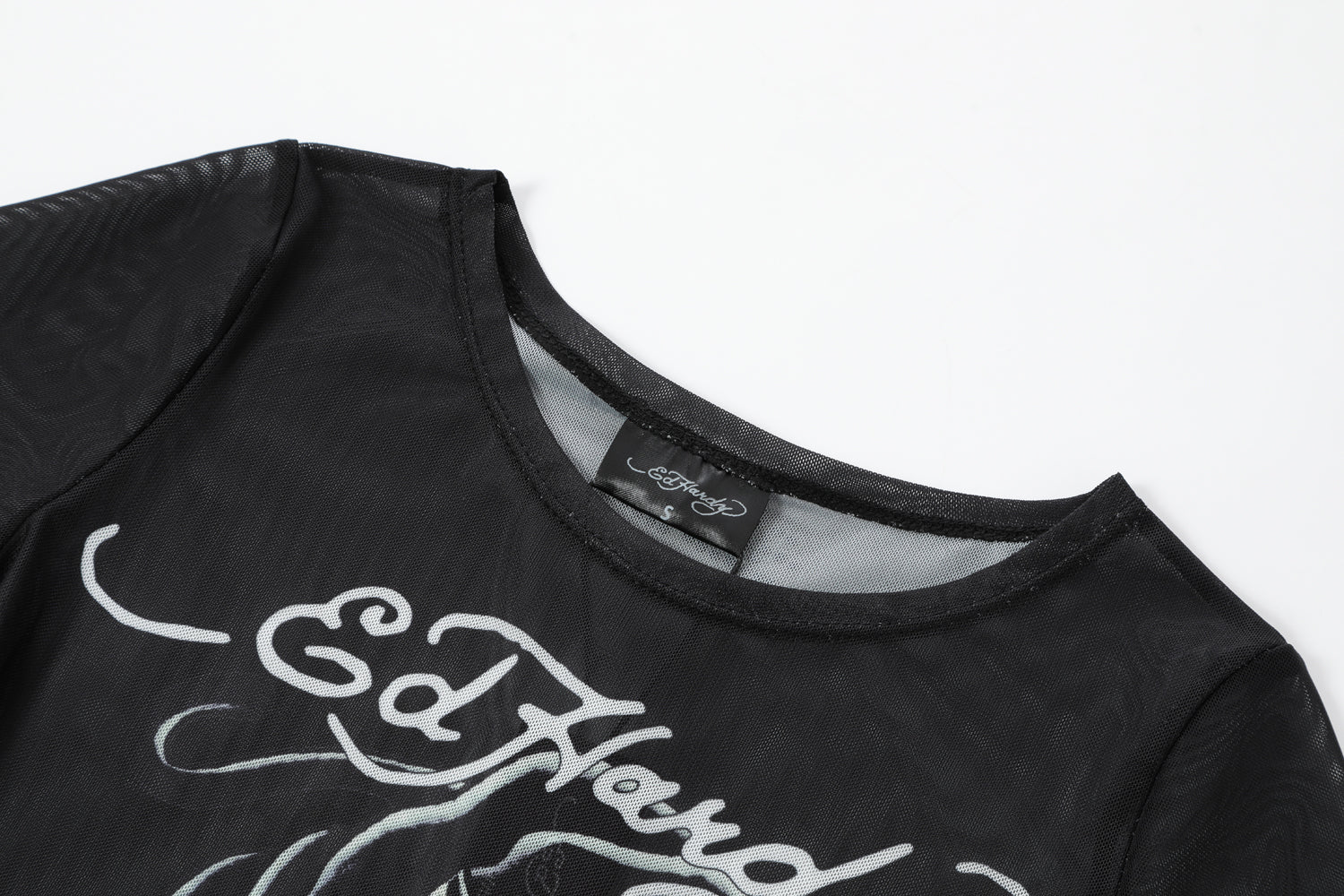 Close-up detail of Ed Hardy Venom Panther Swim Tee in black print