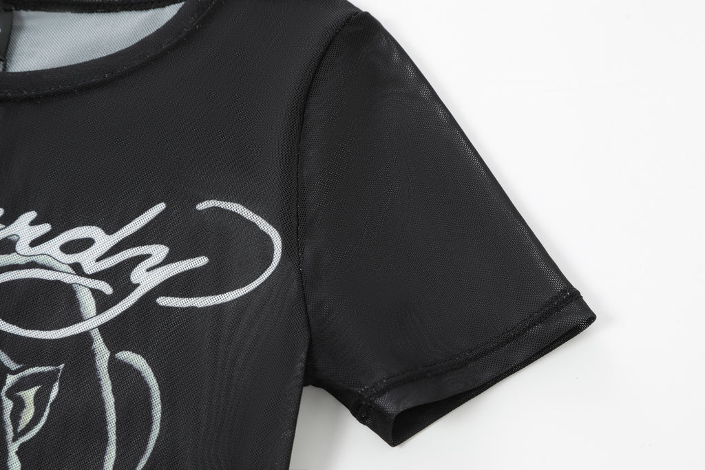 Close-up detail of Ed Hardy Venom Panther Swim Tee in black print