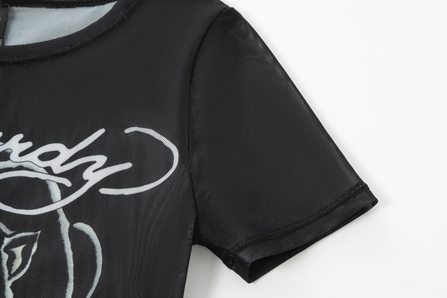 Close-up detail of Ed Hardy Venom Panther Swim Tee in black print