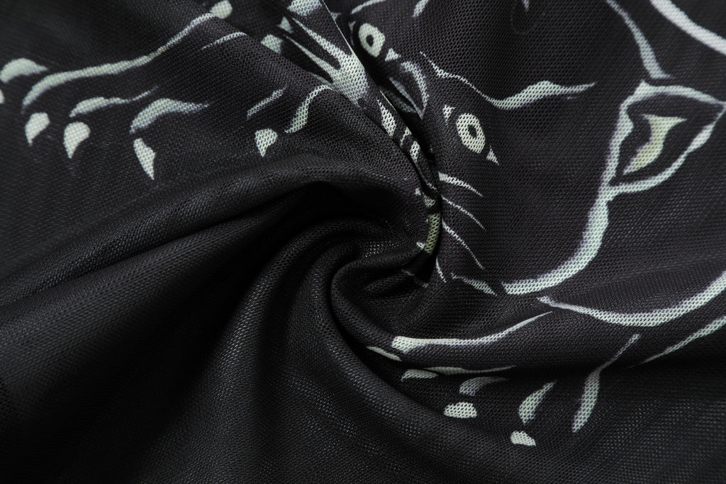 Close-up detail of Ed Hardy Venom Panther Swim Tee in black print