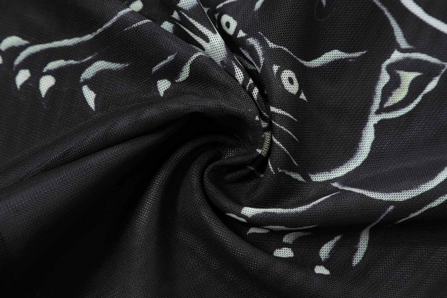 Close-up detail of Ed Hardy Venom Panther Swim Tee in black print