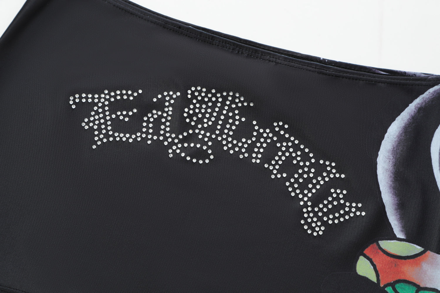 Close-up detail of Ed Hardy Vintage Rose Swim Skirt in black print