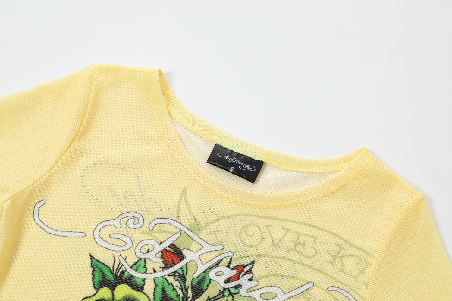 Close-up detail of Ed Hardy Vintage Rose Swim Tee in yellow print