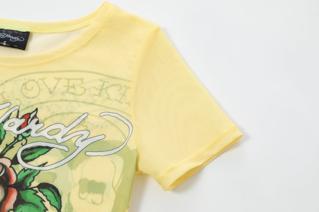 Close-up detail of Ed Hardy Vintage Rose Swim Tee in yellow print
