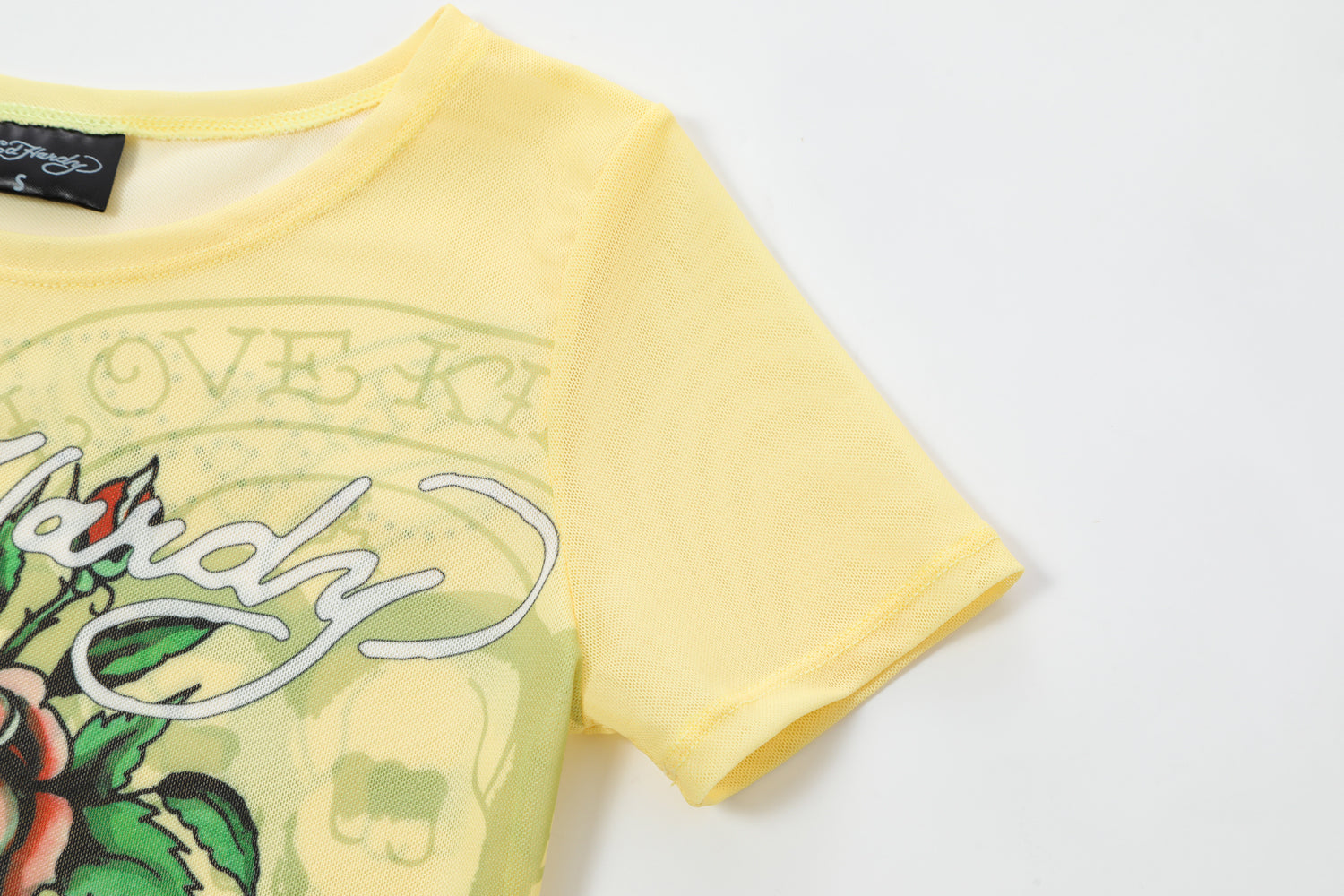 Close-up detail of Ed Hardy Vintage Rose Swim Tee in yellow print