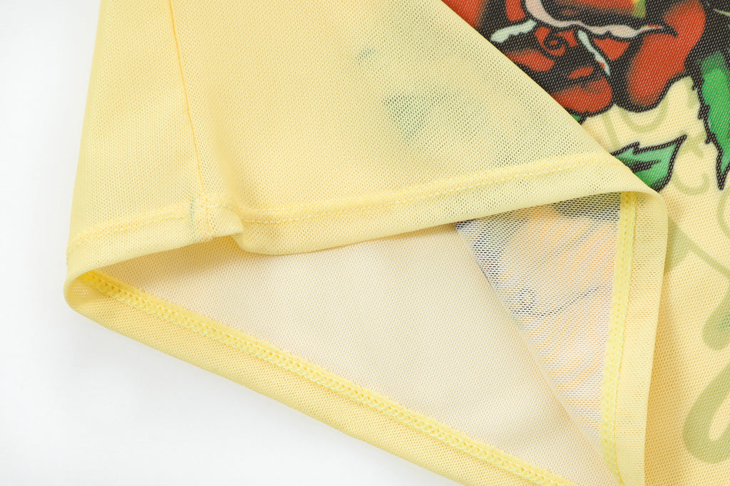 Close-up detail of Ed Hardy Vintage Rose Swim Tee in yellow print