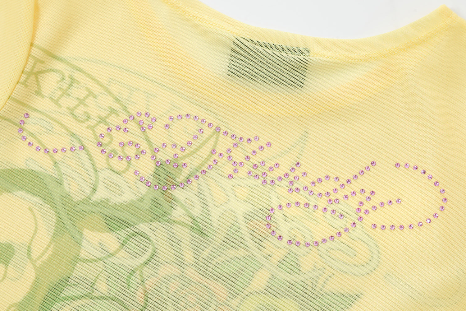 Close-up detail of Ed Hardy Vintage Rose Swim Tee in yellow print