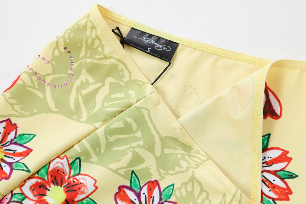 Close-up detail of Ed Hardy Vintage Rose Swim Skirt in yellow print