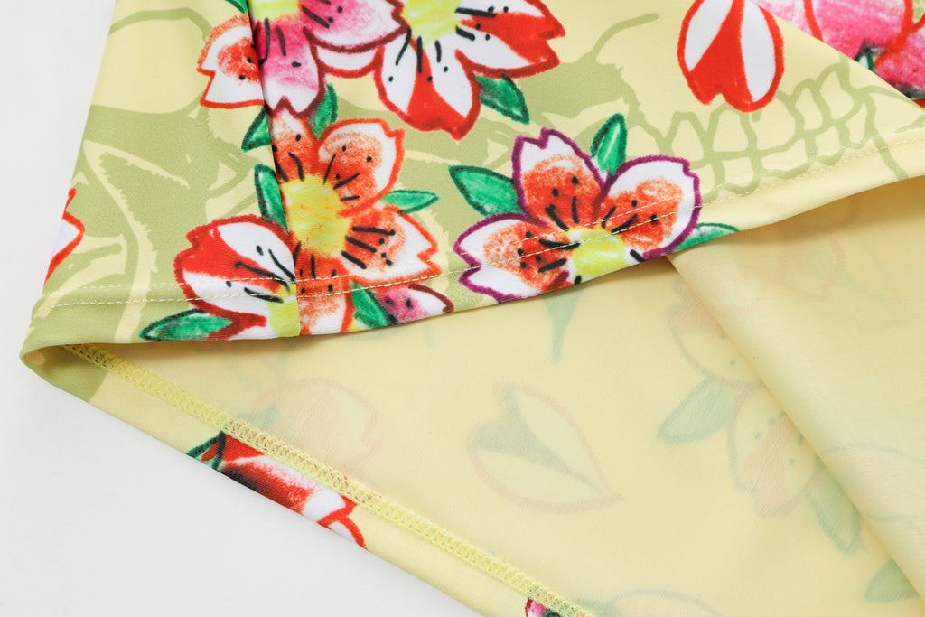 Close-up detail of Ed Hardy Vintage Rose Swim Skirt in yellow print
