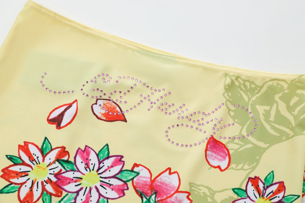 Close-up detail of Ed Hardy Vintage Rose Swim Skirt in yellow print