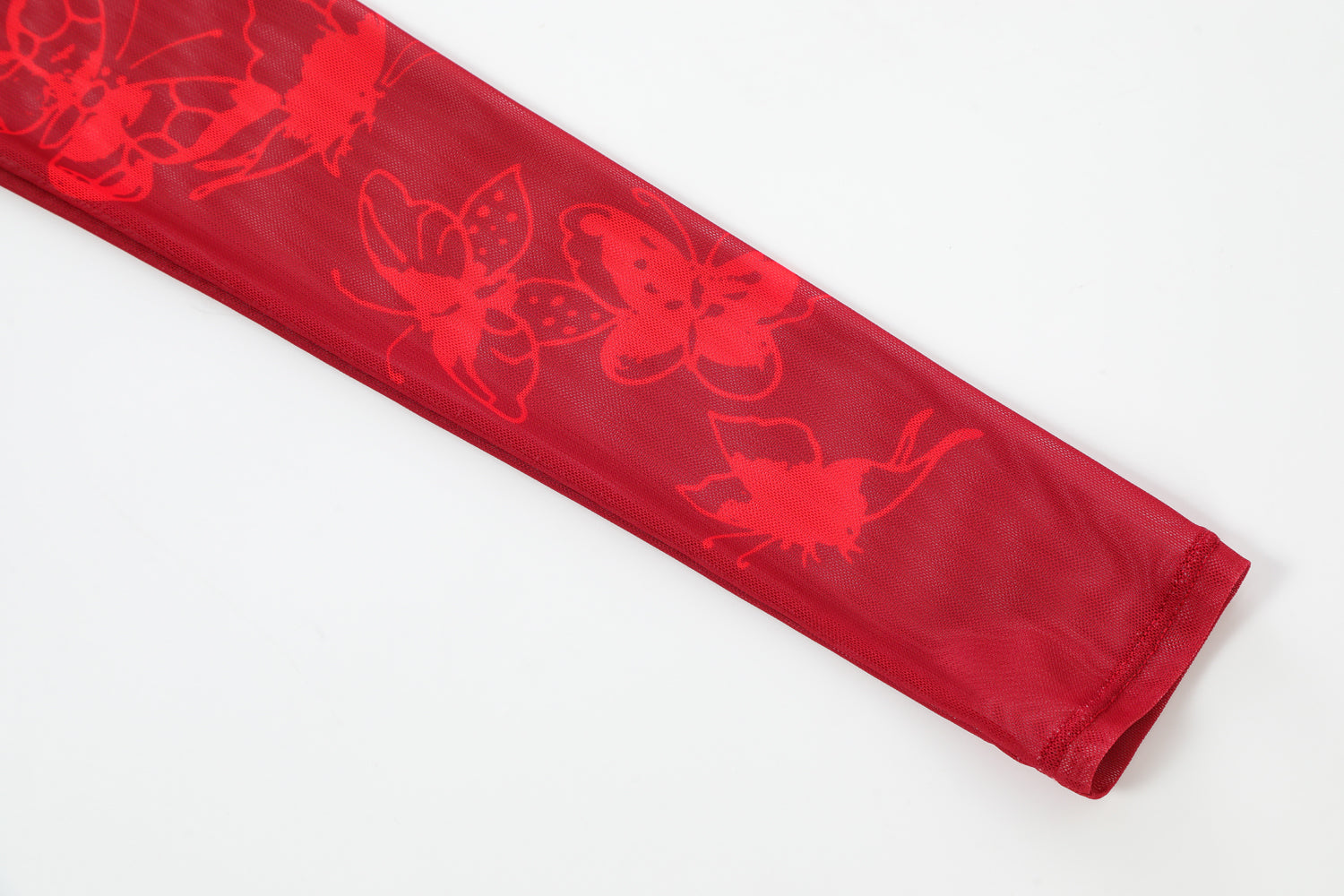 Close-up detail of Ed Hardy Rebel Rose Mesh Maxi Set in red print
