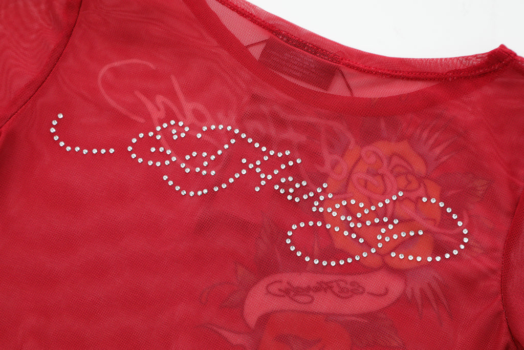 Close-up detail of Ed Hardy Rebel Rose Mesh Maxi Set in red print