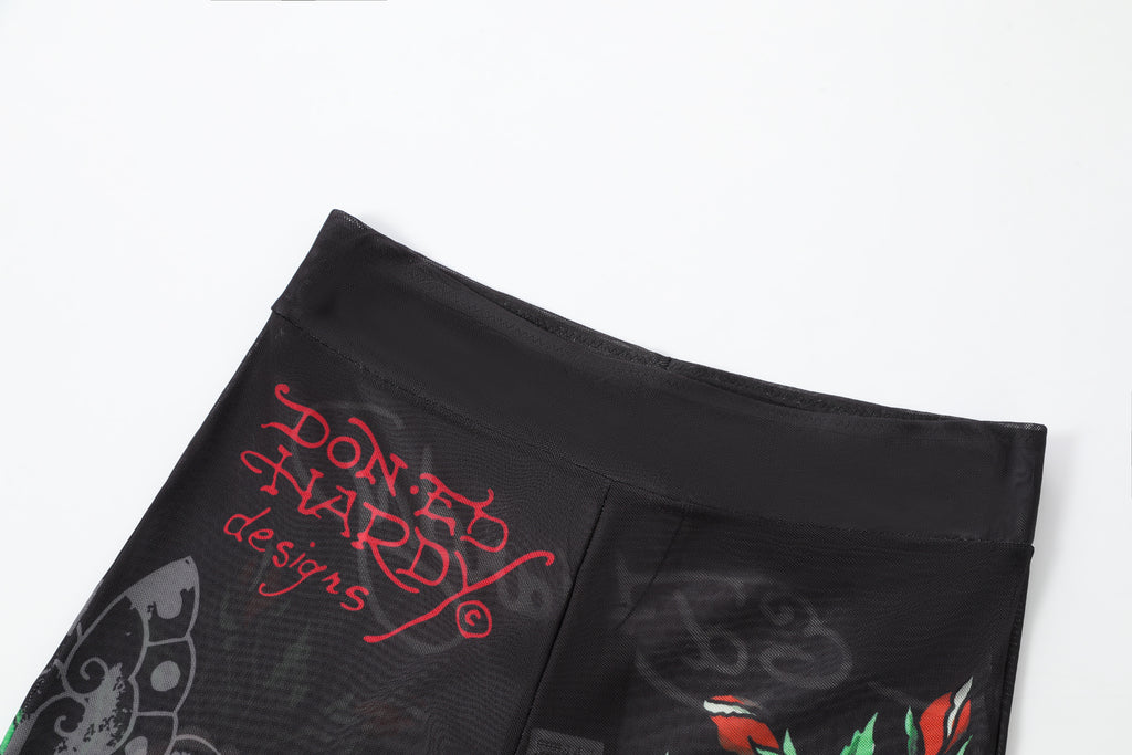 Close-up detail of Ed Hardy Traditional Rose Swim Flare in black print